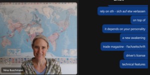 Nina teaching online with world map in background and chat open